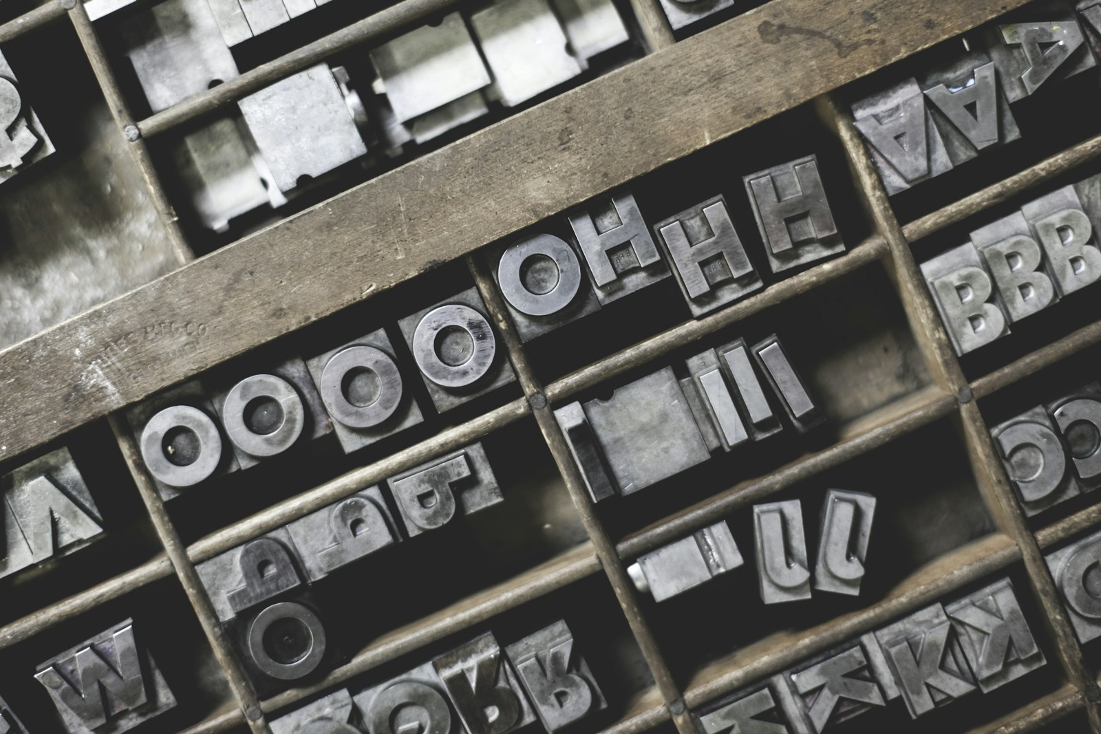 Metal letterpress type sorts in a printer's tray, the craft tradition independent foundries carry forward