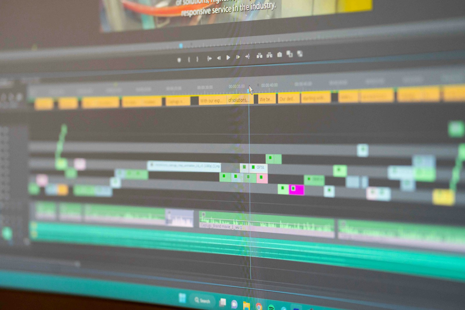 Video editing timeline with stacked clips on a dark editor, where captions and lower thirds are built